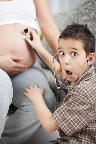 Brother and sister playing doctor